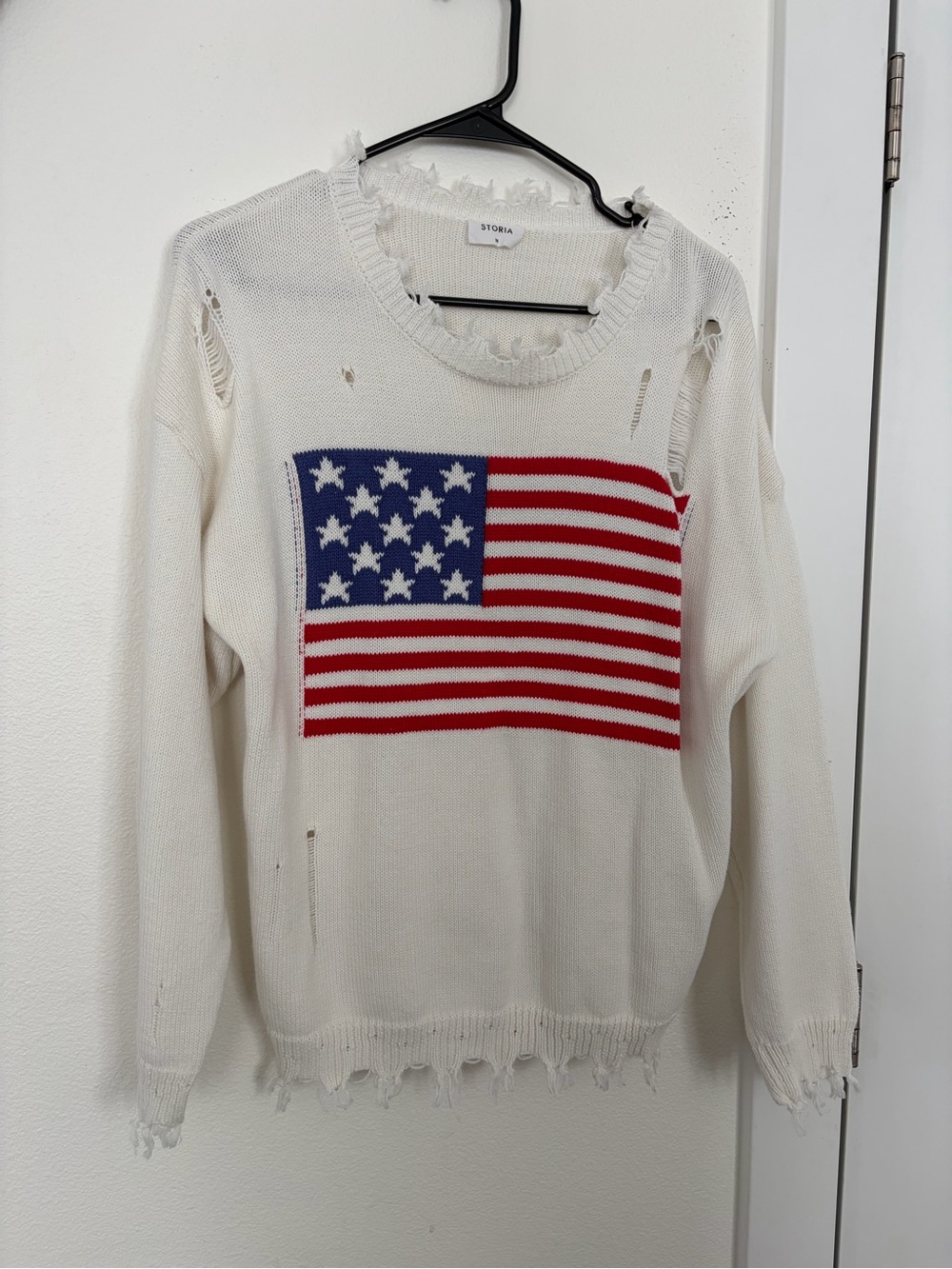 Storia White Knit Sweater with Red and Blue Flag Graphic